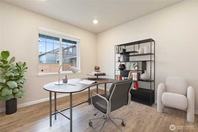 office space featuring recessed lighting, wood finished floors, and baseboards