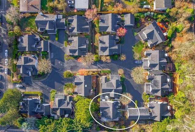 birds eye view of property with a residential view