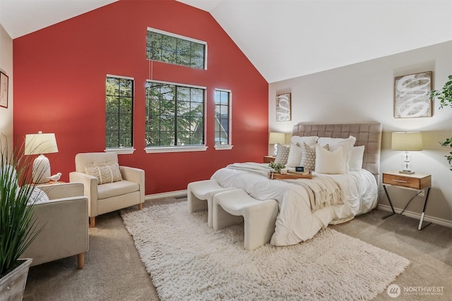 carpeted bedroom with high vaulted ceiling and baseboards