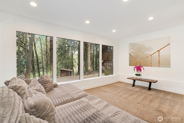 living area with carpet flooring, recessed lighting, and baseboards