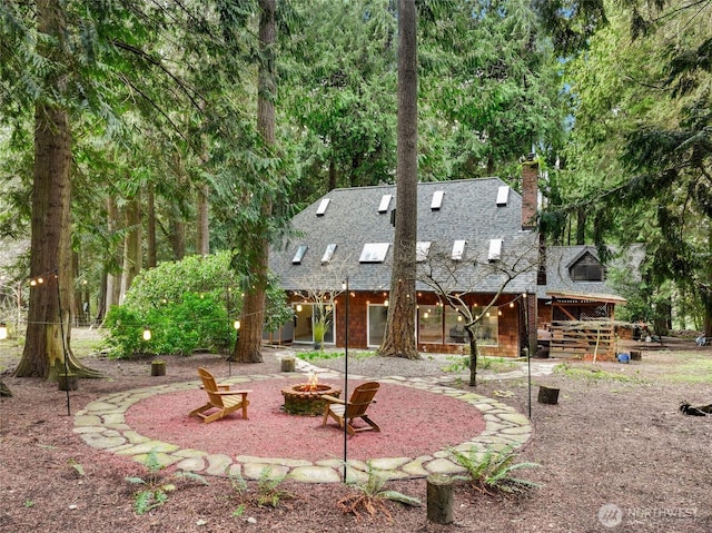 view of yard featuring an outdoor fire pit