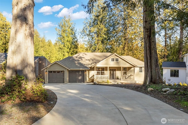 view of front facade with a porch, concrete driveway, and an attached garage