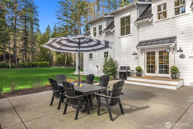 view of patio / terrace with area for grilling, french doors, and outdoor dining area