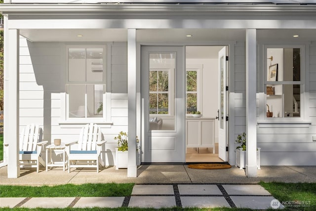 doorway to property featuring covered porch