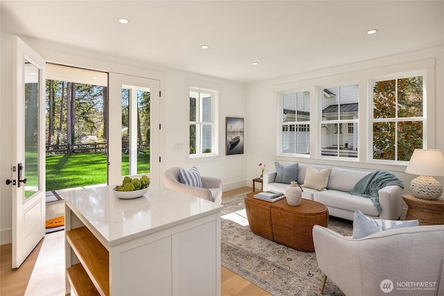 living room with recessed lighting and light wood-type flooring