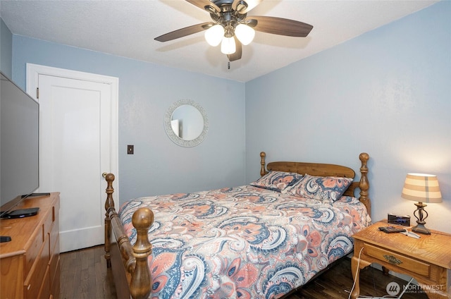 bedroom featuring wood finished floors and ceiling fan