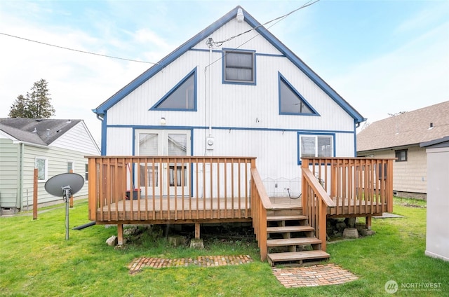 back of house featuring a yard and a deck