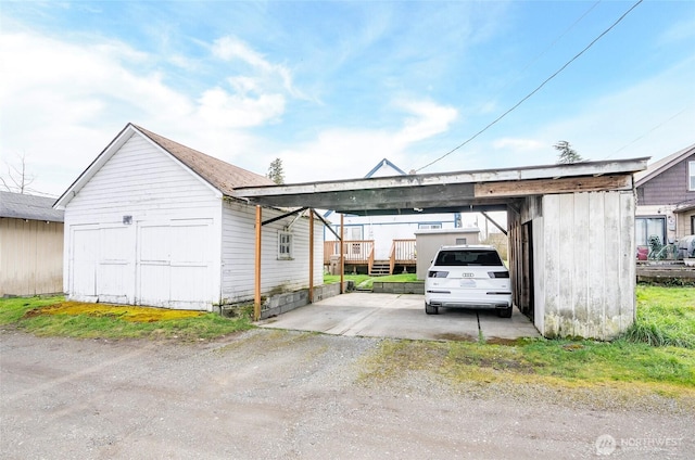 view of vehicle parking with a carport