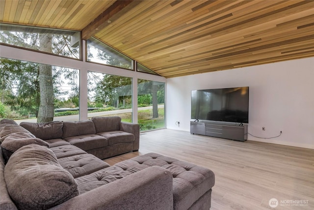 living area featuring vaulted ceiling with beams, wood finished floors, and wooden ceiling