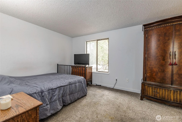 bedroom with a textured ceiling, baseboards, and light carpet