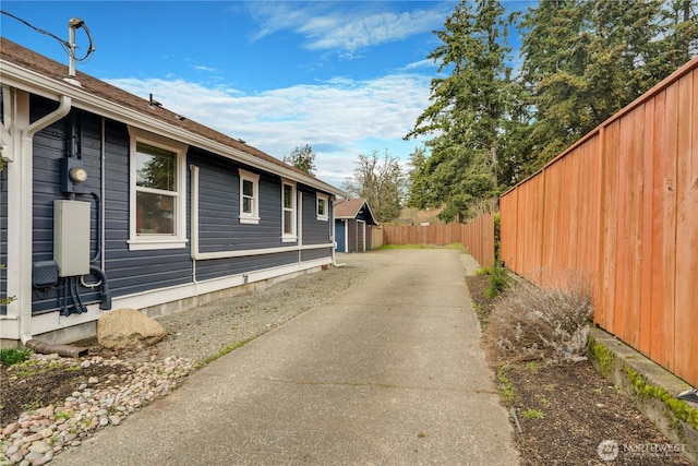 view of side of property featuring fence