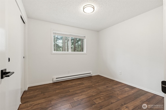 empty room featuring a baseboard heating unit, wood-type flooring, a textured ceiling, and baseboards