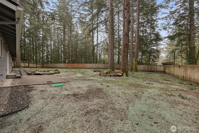 view of yard with a fenced backyard and a patio