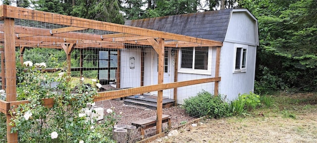 exterior space with a shingled roof