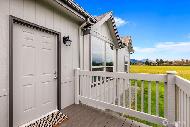 doorway to property featuring a lawn and a mountain view