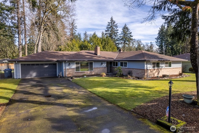 single story home featuring a front lawn, brick siding, a garage, and driveway