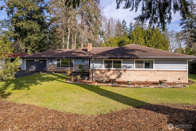 ranch-style house with brick siding, a front lawn, aphalt driveway, a chimney, and a garage