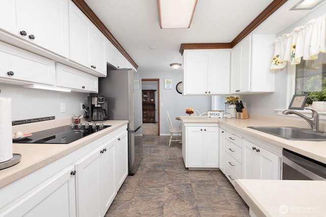 kitchen with a sink, white cabinetry, light countertops, black electric stovetop, and dishwasher