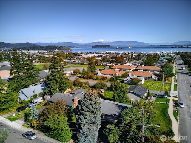 bird's eye view featuring a water and mountain view and a residential view