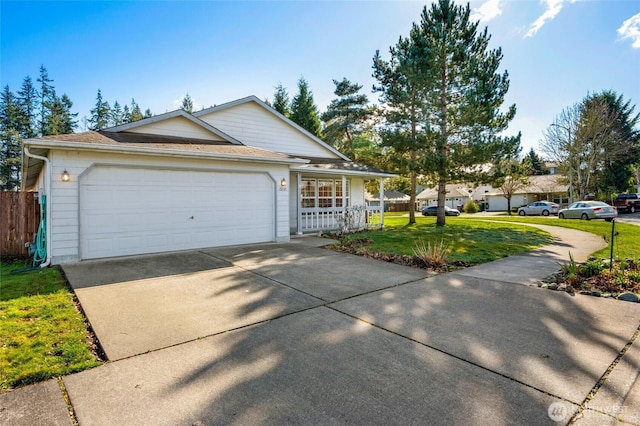 ranch-style home with driveway, a porch, fence, a front yard, and an attached garage