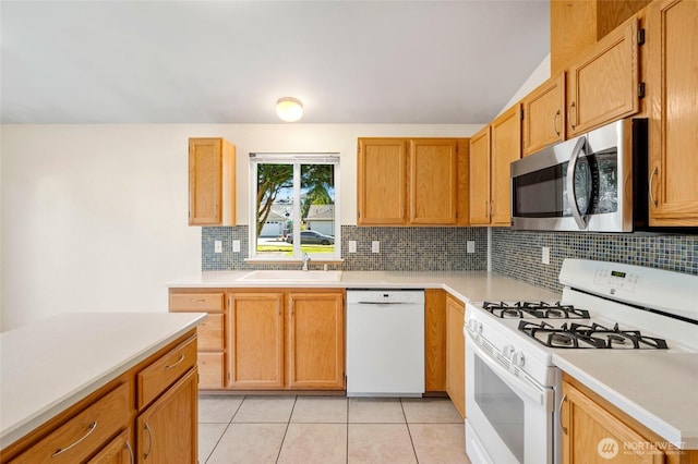 kitchen featuring a sink, white appliances, light tile patterned flooring, and light countertops