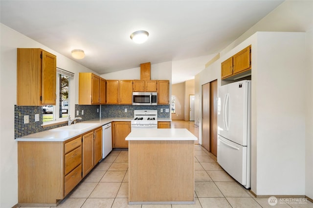 kitchen with backsplash, a center island, vaulted ceiling, white appliances, and a sink