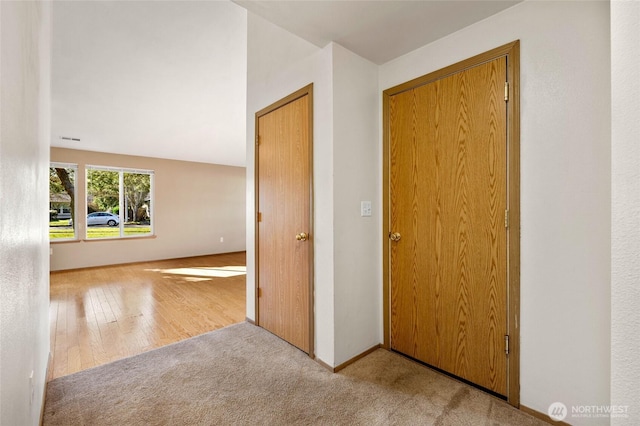 carpeted spare room with visible vents