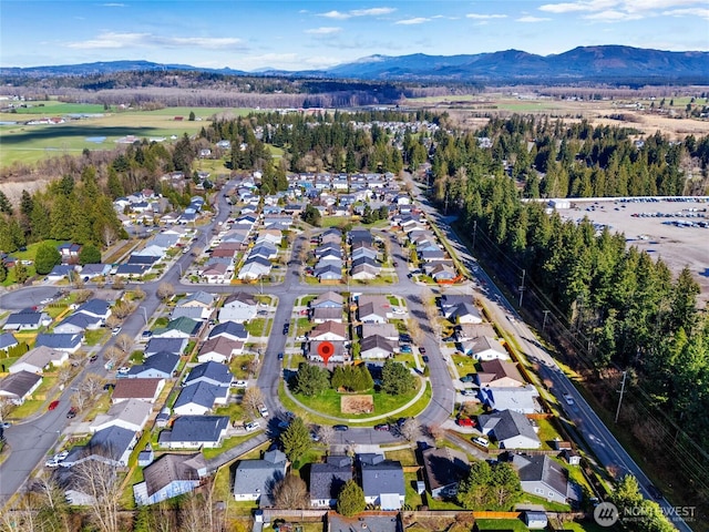 aerial view featuring a mountain view and a residential view