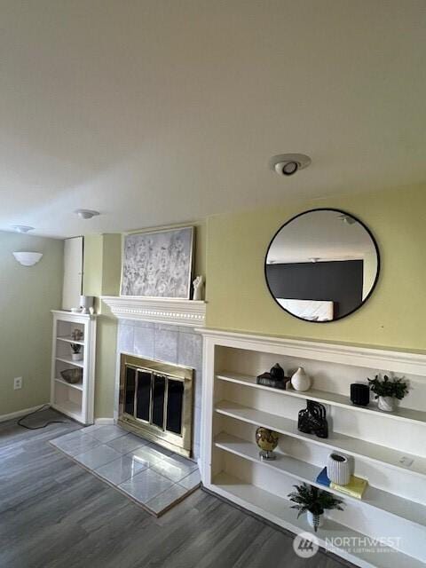 interior space featuring a fireplace and wood finished floors