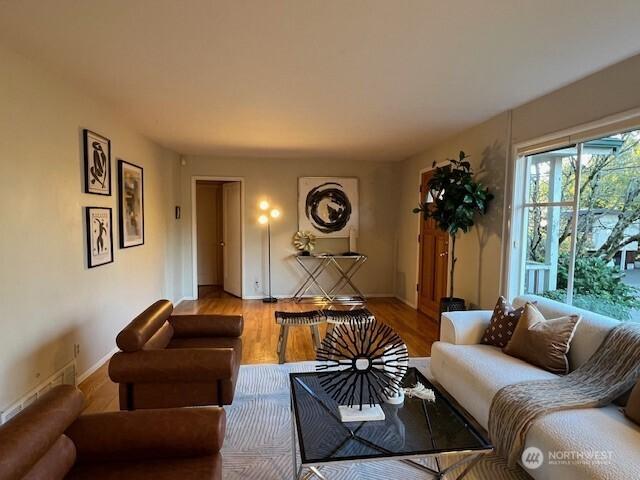 living area featuring wood finished floors and baseboards