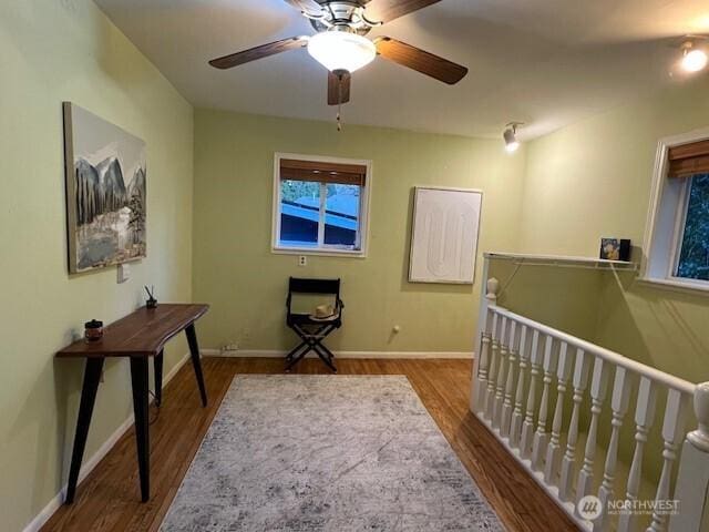 home office with wood finished floors and baseboards