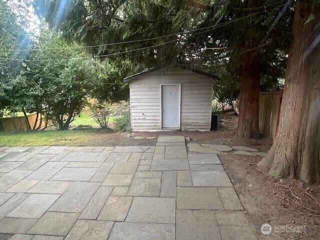 view of shed with fence