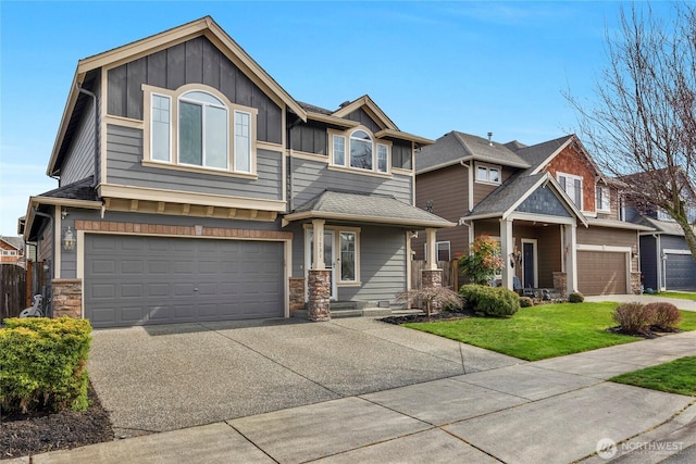 view of front of house featuring concrete driveway, a garage, board and batten siding, and stone siding