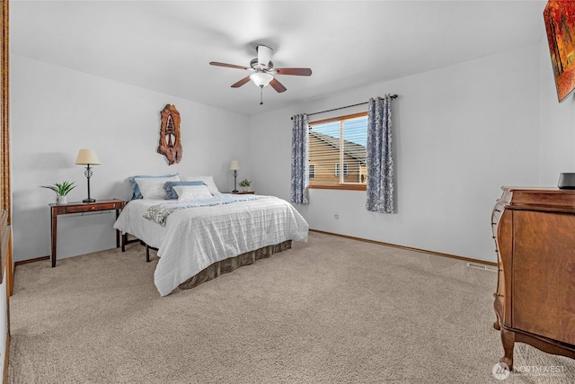 carpeted bedroom featuring visible vents, ceiling fan, and baseboards