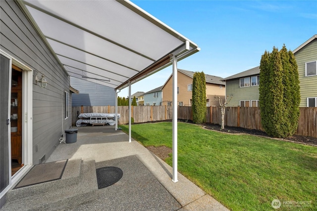 view of yard with a fenced backyard and a patio