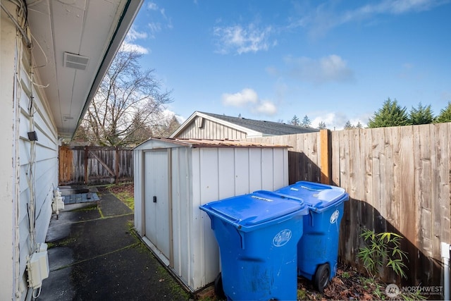 view of shed with a fenced backyard