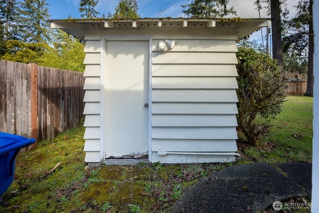 view of shed with fence