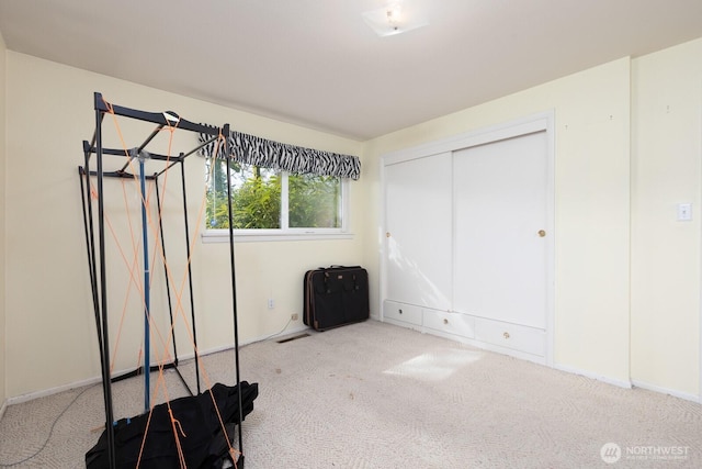 unfurnished bedroom featuring visible vents, a closet, and carpet flooring