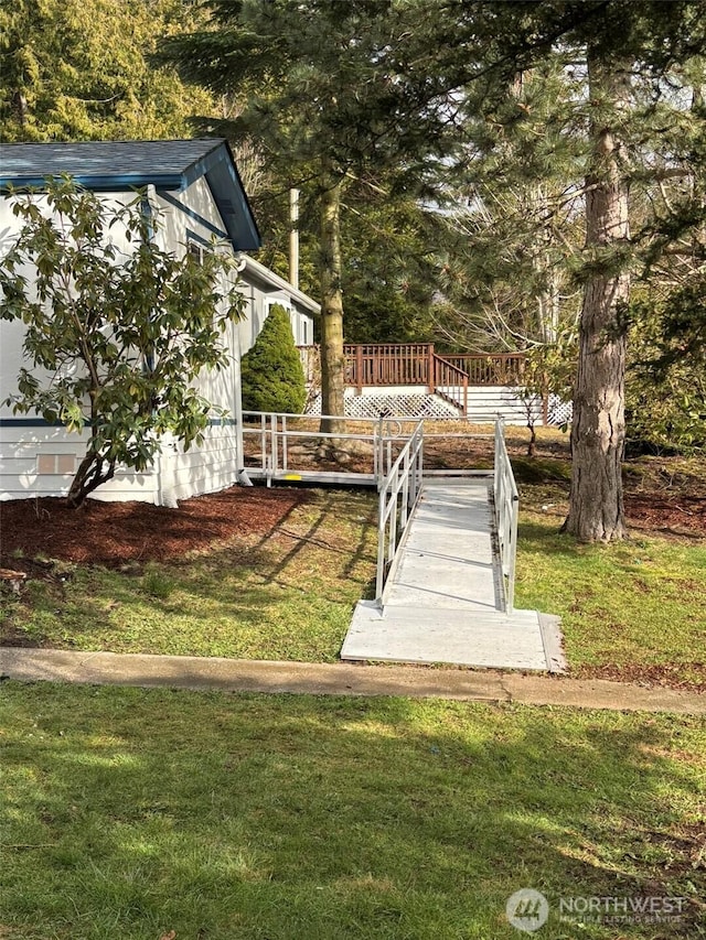 view of yard with a wooden deck