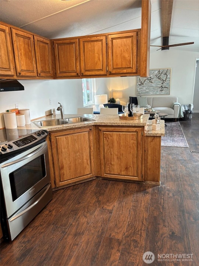 kitchen with dark wood-type flooring, brown cabinets, electric range, a ceiling fan, and a sink