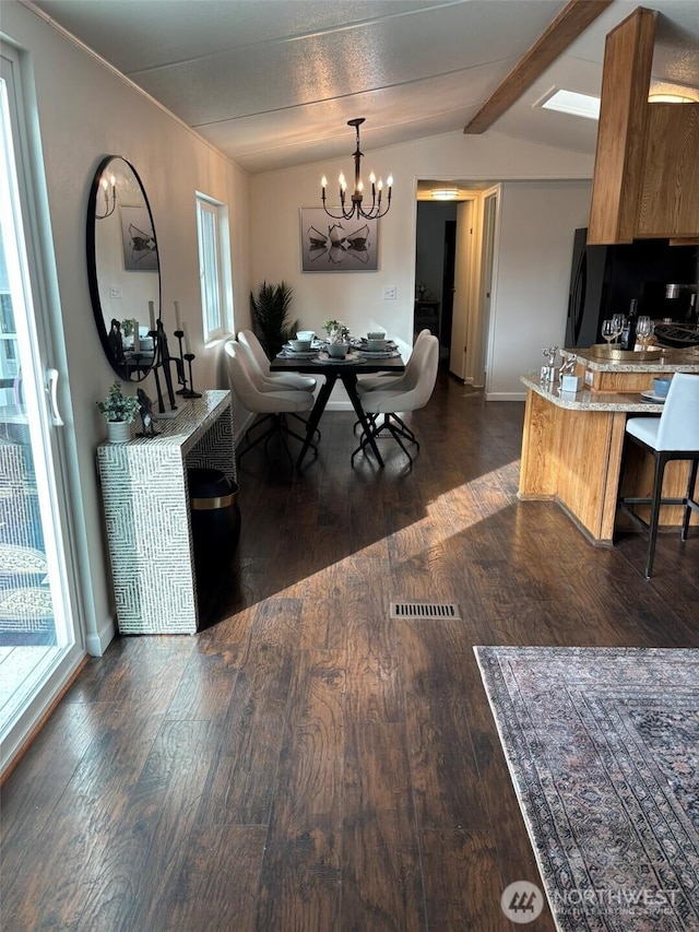 dining area featuring dark wood-style floors, a notable chandelier, vaulted ceiling with beams, and visible vents