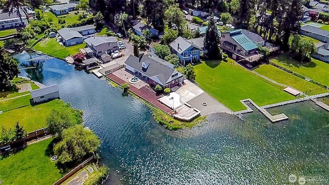 birds eye view of property with a residential view and a water view