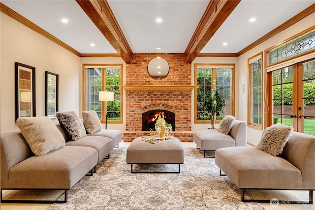 living room featuring crown molding, beamed ceiling, recessed lighting, a fireplace, and french doors