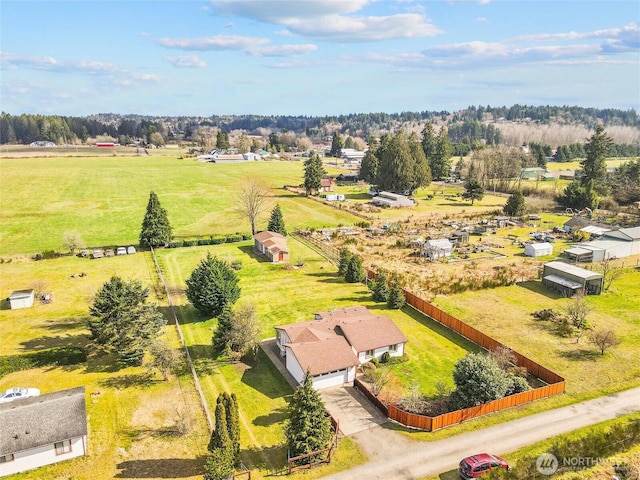 birds eye view of property with a rural view