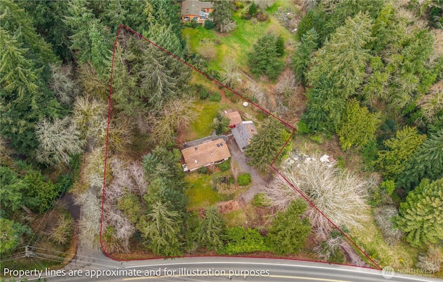 bird's eye view featuring a forest view