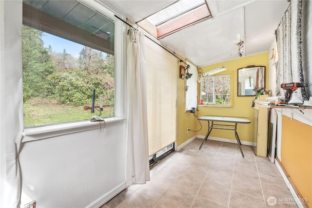 sunroom featuring track lighting