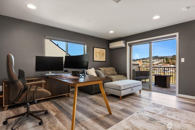 office area featuring recessed lighting, wood finished floors, and a wall mounted air conditioner