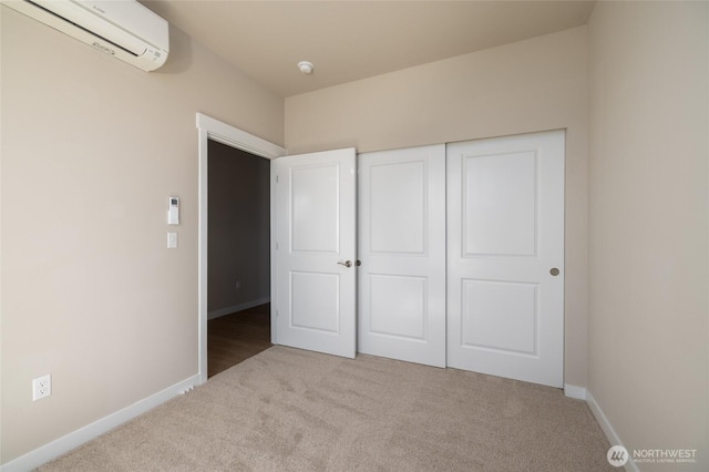776 Parkland Loop, Sedro Woolley, WA 98284 - unfurnished bedroom featuring a wall unit AC, carpet, baseboards, and a closet