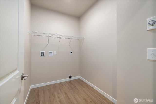 776 Parkland Loop, Sedro Woolley, WA 98284 - laundry area featuring light wood-type flooring, hookup for an electric dryer, washer hookup, and baseboards