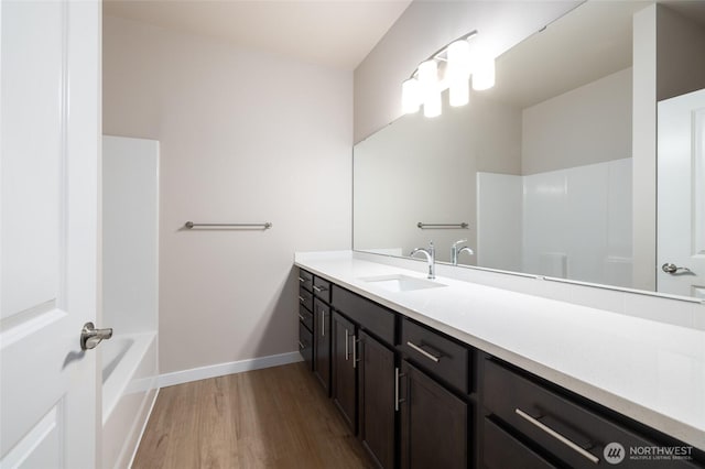 776 Parkland Loop, Sedro Woolley, WA 98284 - full bathroom featuring vanity, wood finished floors, baseboards, and shower / bath combination
